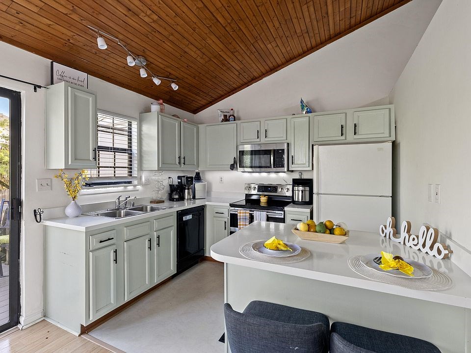 kitchen this sleek kitchen is perfect for the first time home buyer, starter family, etc. it offers good space and a barstool area for meals.
